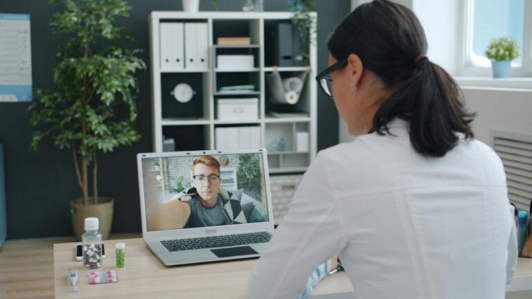 Healthcare provider reviewing patient symptoms during a telehealth consultation for a medical certificate